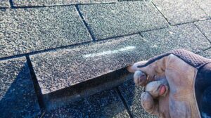 Roofing samples beside a rating chart showing solar reflectance and thermal emittance values.